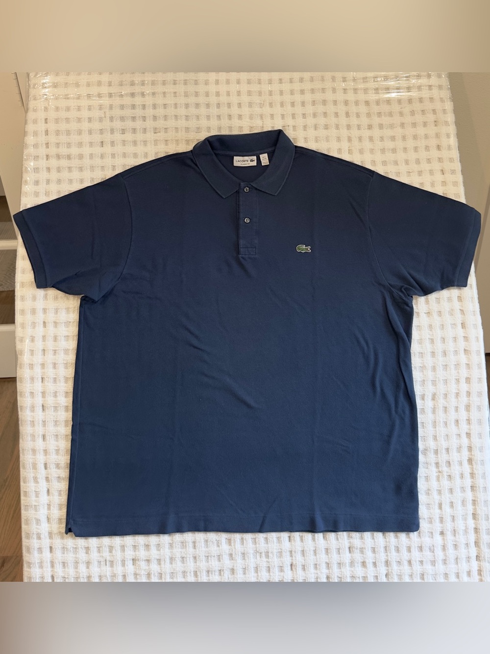 Lacoste Men’s Classic Navy Polo Shirt 31” Tall, 26” wide, 9 sleeve